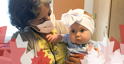 A photo of a doctor holding a baby